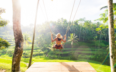 ubud, bali, lady swinging in rice fields