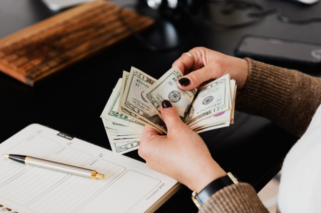 counting USD counting USD notes at a desk