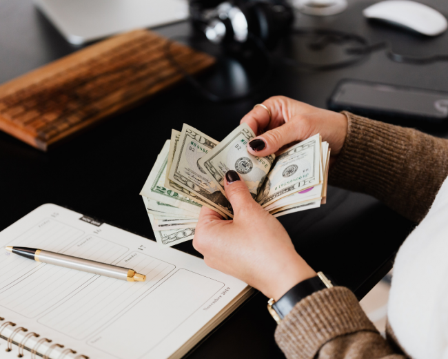 counting USD counting USD notes at a desk